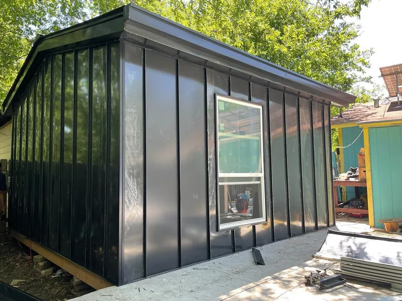 Black standing seam metal wall panels for Roof Inspection in Merrill