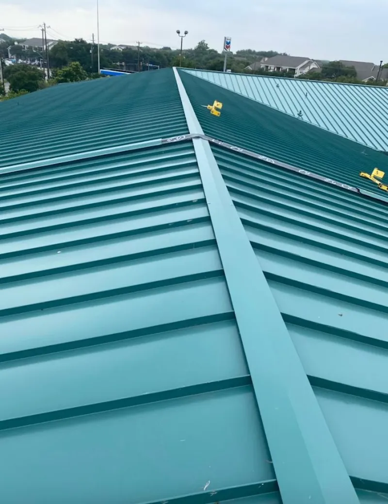 Green commercial metal roof ridge and valley for Metal Roof Repair in Merrill
